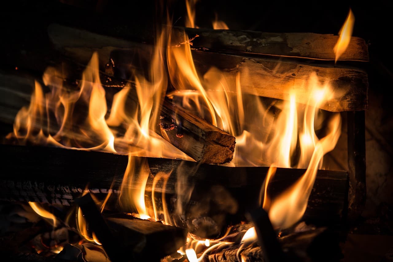 Logs burning in an open fireplace